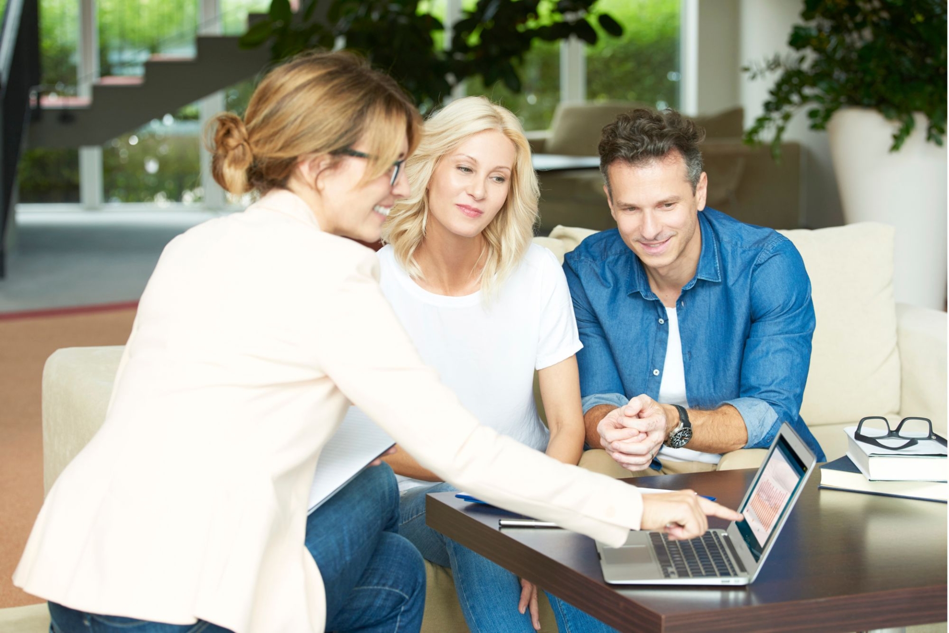 adviser helping a couple with their policies