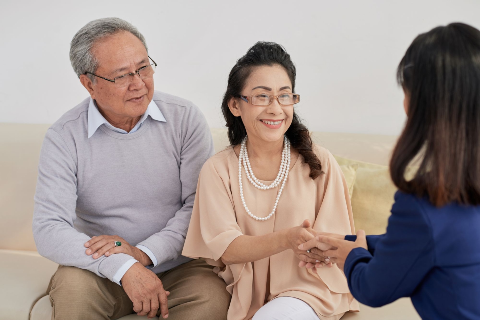 happy retired couple with a consultant